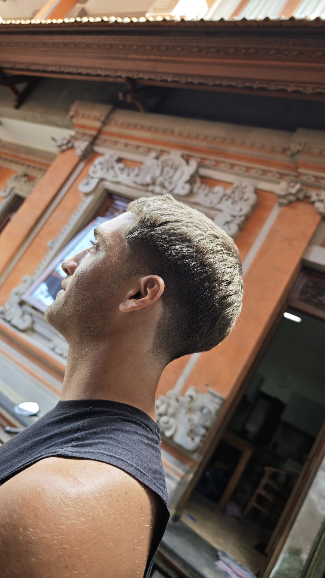 Textured short haircut with blended sides, photographed outdoors in Bali